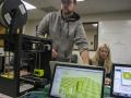 Students using 3D printer in Makerspace