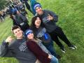 Carly Solberg poses with students for slefie