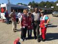  Ann Gang, Sally Bowers, a local police officer and Kathy De Bel help residents recover from Hurricane Matthew in North Carolina.