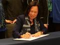 President Judy K. Sakaki signs President's Climate Commitment 