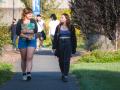 Two students walking on SSU's campus by Ives Hall