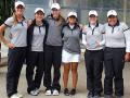 women's golf holds second place trophy