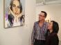 SSU President Judy Sakaki and FIGR Tribal Chairman Greg Sarris admire a self-portrait by Joan Baez