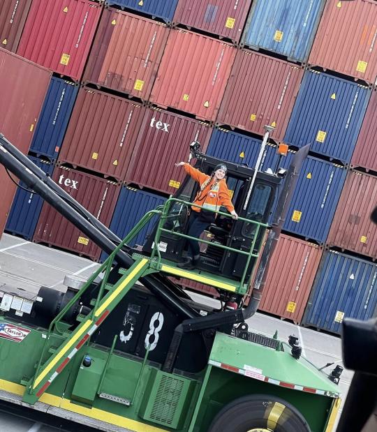 SSU alumna Gina Villeggiante on the docks with shipping containers