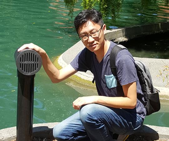 Feng Wang with his flood warning system