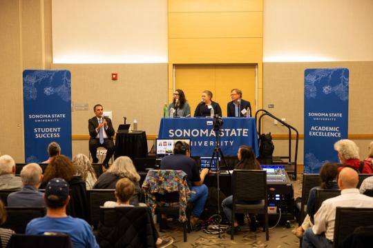 Three panelists and a moderator at SSU alumni panel about 2024 election