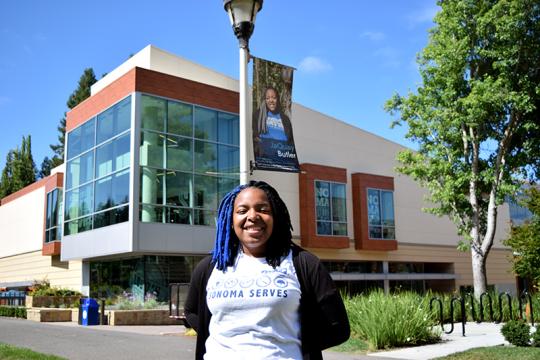 JaQuay Butler under her faces of ssu sign