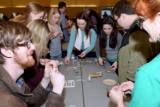 makers surrounding a table