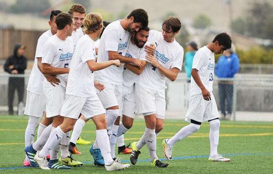 men's soccer team celebrates victory