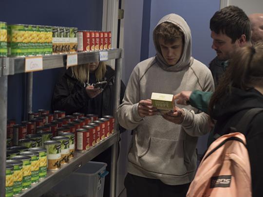 Visitors exploring the new Lobo's Pantry // Photo by Nate Galvan