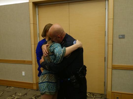 Chief Dougherty's hugging his family // Photo by Francisco Carbajal  