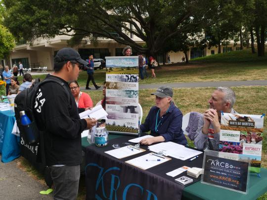 Student learning about new opportunities at tabling event//  Photo by Francisco Carbajal