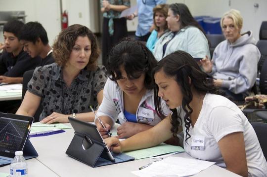 SSU Education Professor Kelly Estrada, left, in the classroom with K-12 students