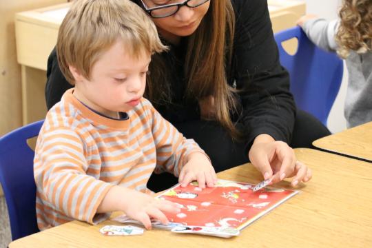Child and teacher with art