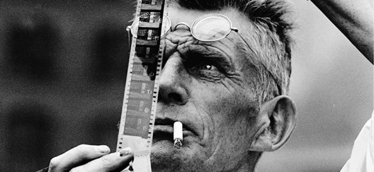 Samuel Beckett examines a piece of film