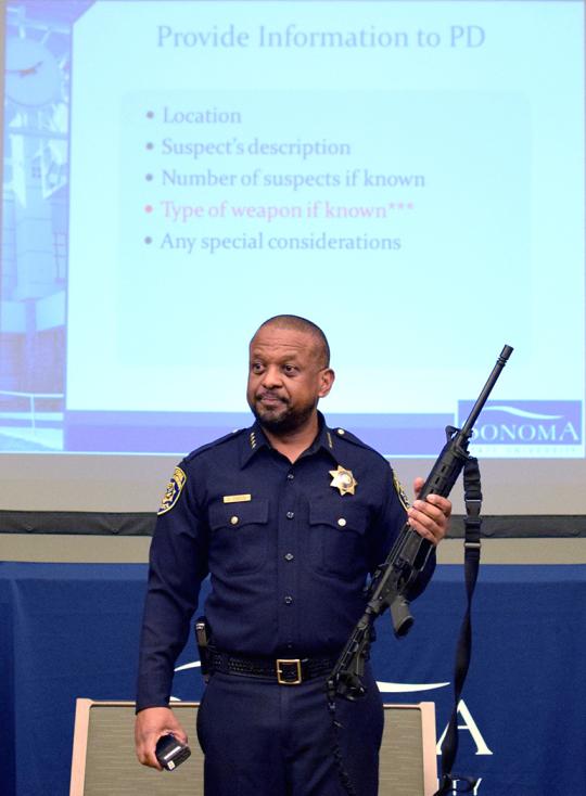 police chief shows automatic weapon