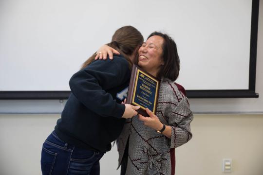 President Sakaki presenting the award to Shannon Brown, the editor-in-chief of the STAR // Photo by Alyssa Archerda 