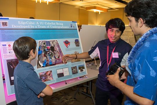 student showing his research