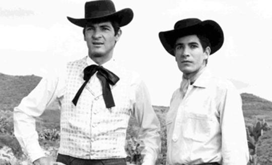 Still from Arturo Ripstein's film "Tiempo De Morir" (1966). Two men in vaquero attire
