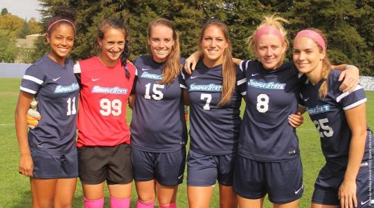 women's soccer team posing for photo