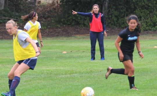 Seventh-year head coach Emiria Salzmann Dunn instructs players during Tuesday's training session.